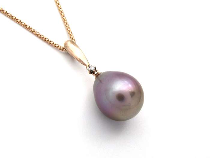 9K gold freshwater pearl and diamond pendant with 18K gold chain.