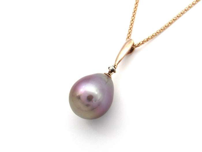 9K gold freshwater pearl and diamond pendant with 18K gold chain.