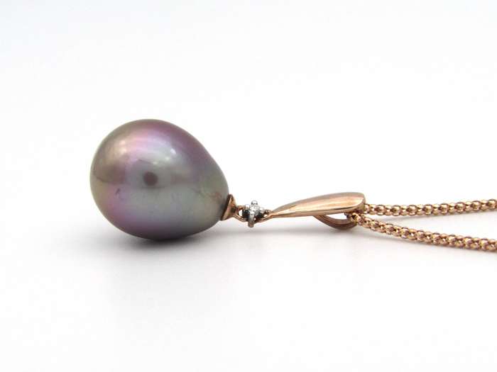 9K gold freshwater pearl and diamond pendant with 18K gold chain.