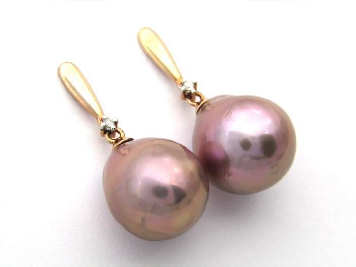 9K gold freshwater pearl and diamond dangle earrings.