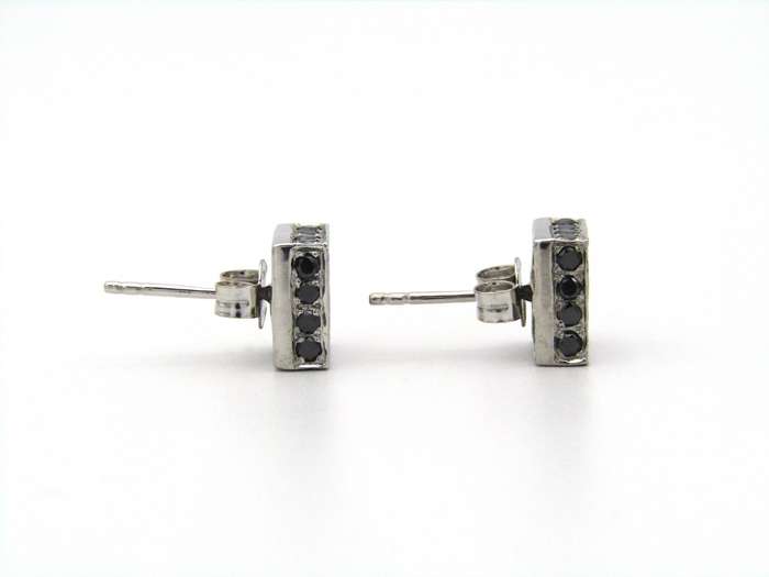 18K gold black and colourless diamond earrings.