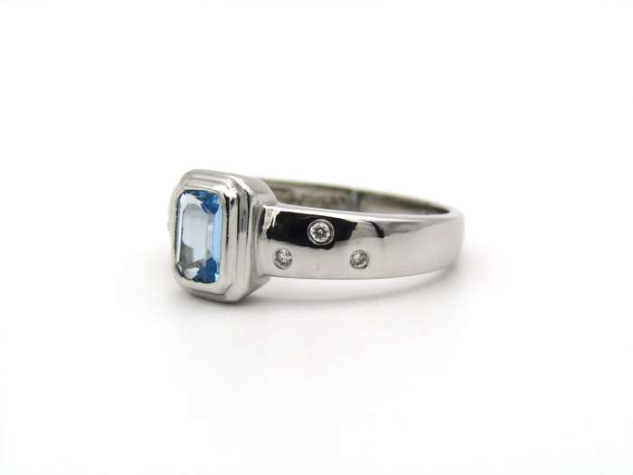 9K gold blue topaz and diamond ring by Browns.