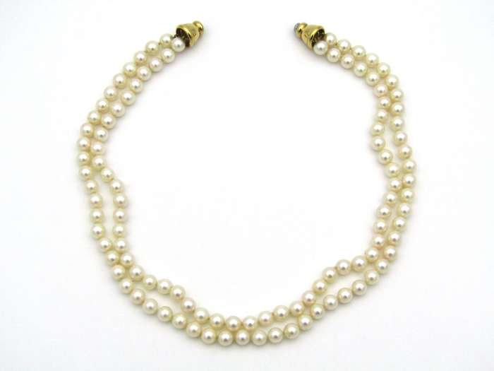 Double strand of pearls with gold plated magnetic clasp.
