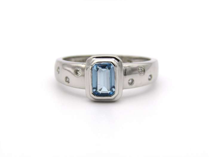 9K gold blue topaz and diamond ring by Browns.