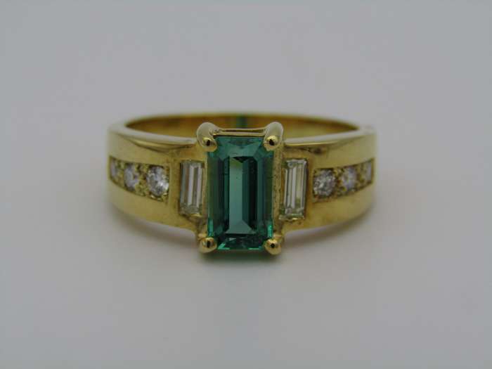 14kt gold emerald and diamond ring.