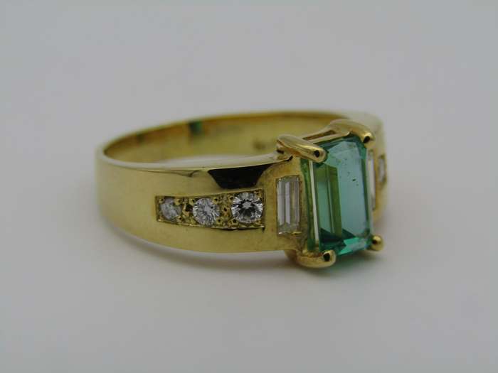 14kt gold emerald and diamond ring.