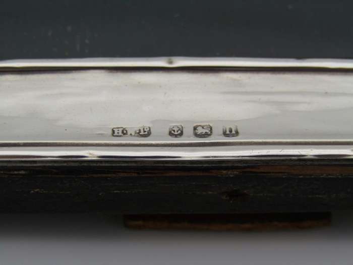 A sterling silver picture frame by Henry Williamson Ltd. Birmingham, 1912.