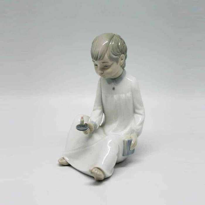 Nao Boy Holding Chamber Stick Figurine