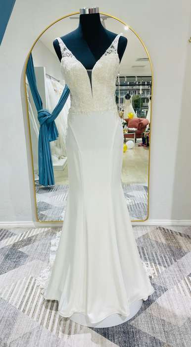 April, crepe mermaid with lace detailed bodice wedding dress.