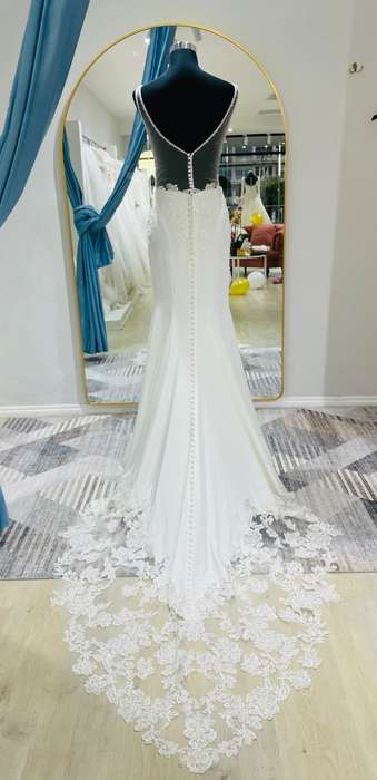 April, crepe mermaid with lace detailed bodice wedding dress.
