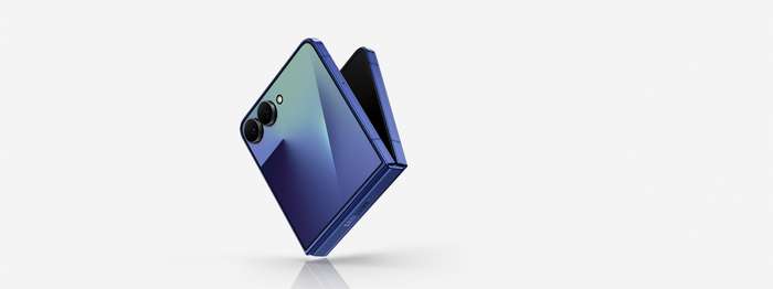 Galaxy Z Flip7 in Blue Shadow is on an angle and slightly unfolded showing the cover screen. Galaxy AI.