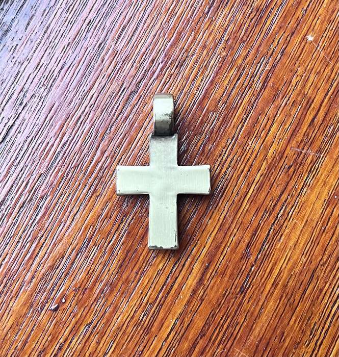 Metal cross pendant with decorative stones