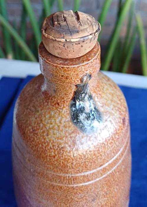 Vintage stoneware Real Vinicola wine bottle