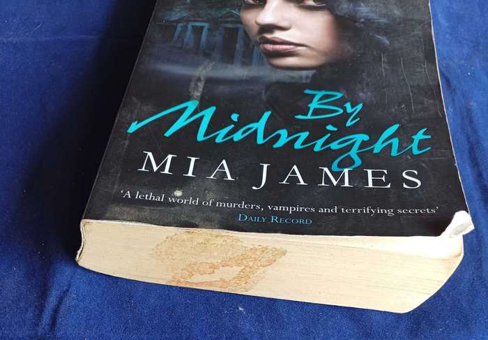 By midnight by Mia James