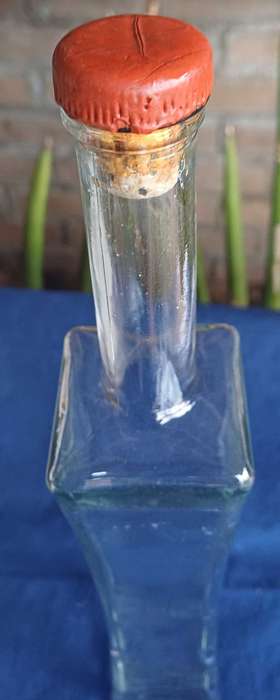 Tall glass bottle
