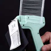 a kit consisting of a tagging gun 5 needles 1000 hair   needles a thick needle gun and a label gun details 1
