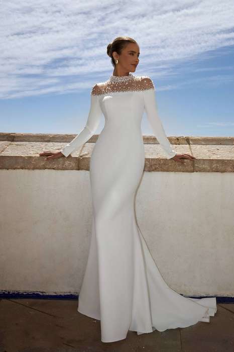 (Rental)Rihanna, halter neck long sleeve with pearl detail sheath wedding dress.