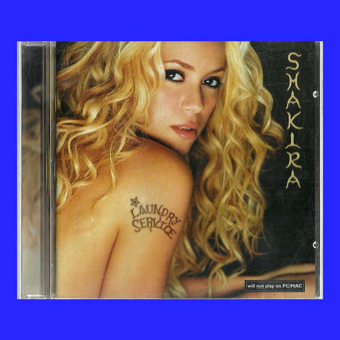 MUSIC CD  - SHAKIRA - LAUNDRY SERVICE (CONDITION - AS NEW)