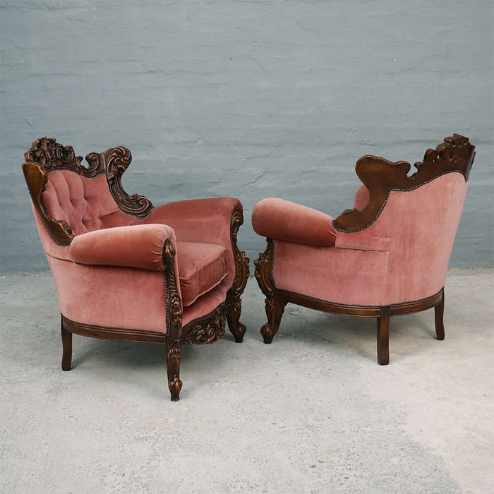 Heavily carved Armchairs