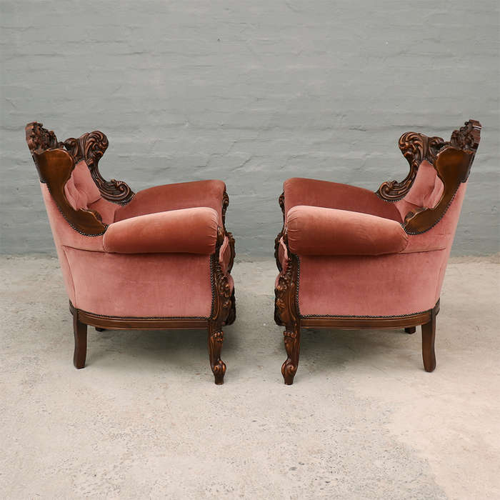 Heavily carved Armchairs