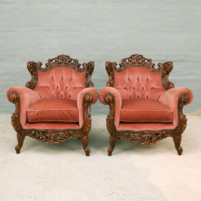 Heavily carved Armchairs
