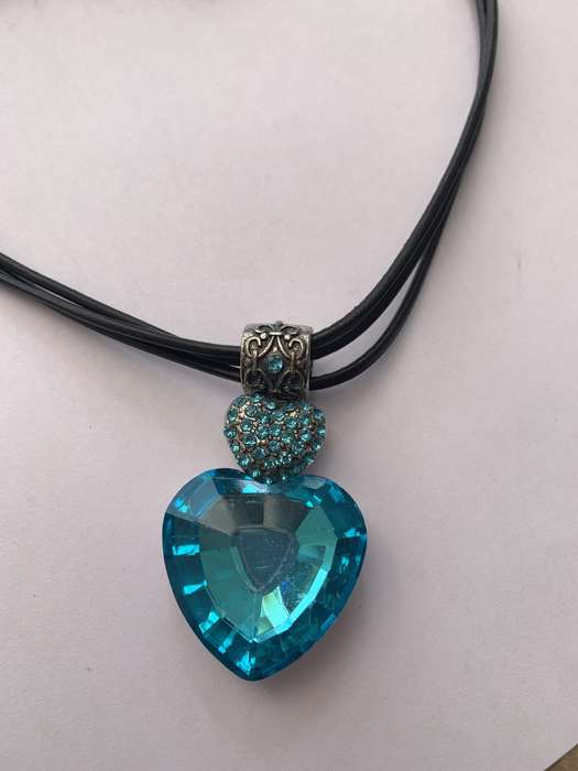 Necklace - Large Silver Tone Aqua Coloured Heart Pendant Suspended from barrel shaped loop, aqua ...