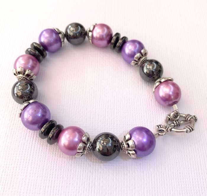 Bracelet - Pink, Purple, Black Beads With Silver Fittings On Wire With Silver Colour Clasp. Bit o...