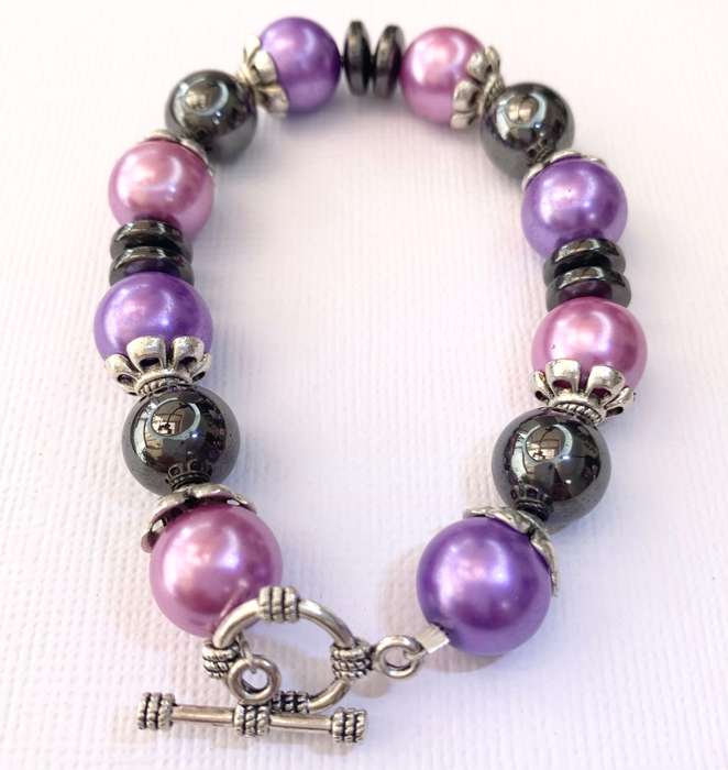 Bracelet - Pink, Purple, Black Beads With Silver Fittings On Wire With Silver Colour Clasp. Bit o...