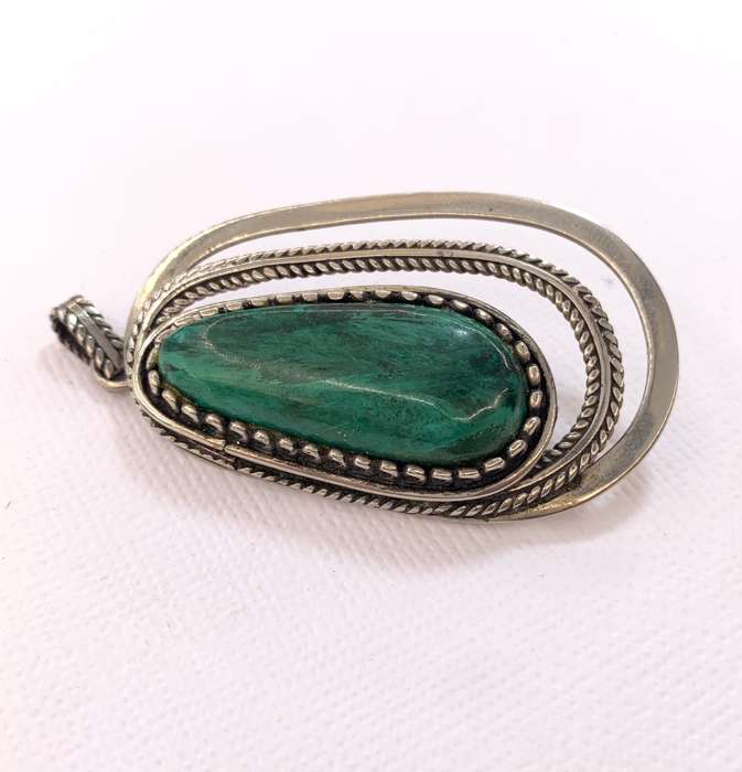 Brooch - Oval Green Stone Surrounded By Silver Oval Cutouts. Silver Coloured #ML1056 R495.00 | Di...