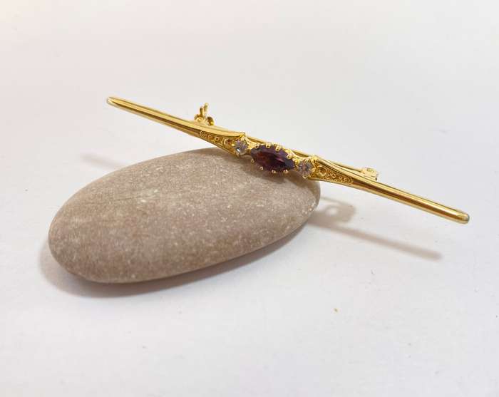 Lapel Pin - Purple Centre Stone, Clear Outer Stones. Gold Coloured