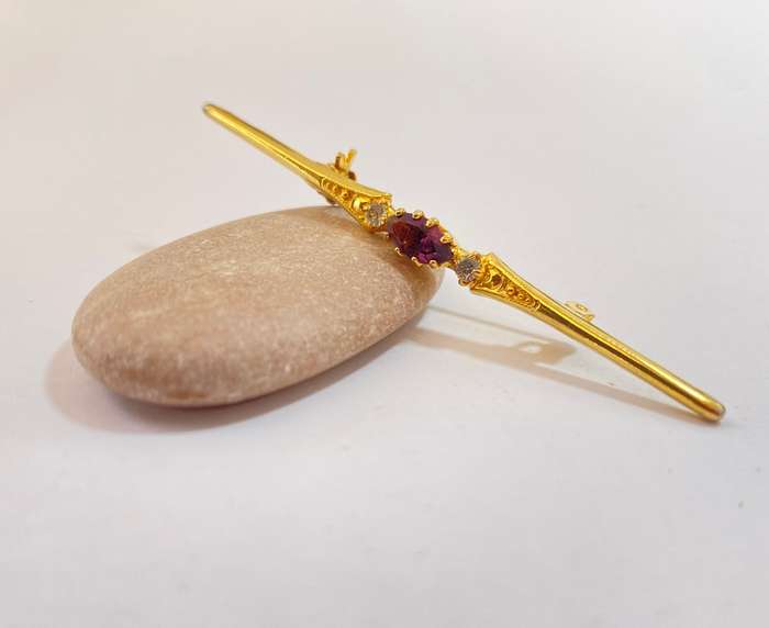 Lapel Pin - Purple Centre Stone, Clear Outer Stones. Gold Coloured