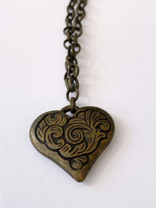 ML1600NecklaceNecklace - Rustic Metal Patterned Heart Pendant on Rustic Metal Chain250.00Rus...