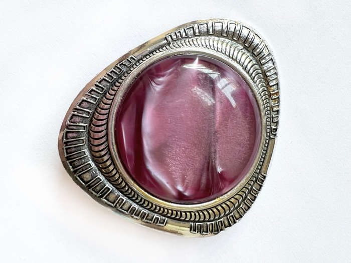Brooch - Large Purple Plastic Stone set in Silver Tone. Curved Triangular Shape Setting ML1787