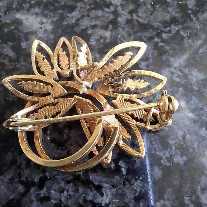 2 gold metal brooches stamped "double" and another indistinct mark.