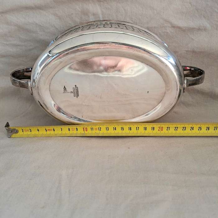 Silver plated fruit dish with two handles.   Walker and Hall.