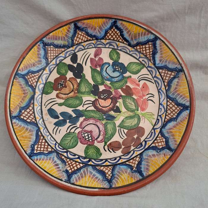 Hand decorated Portugese terra cotta Plate signed - flowers and leaves