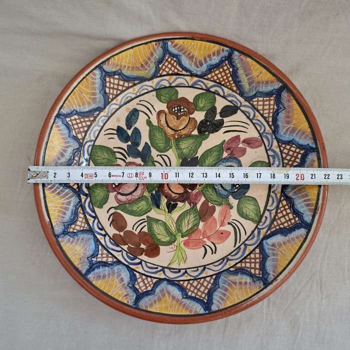 Hand decorated Portugese terra cotta Plate signed - flowers and leaves