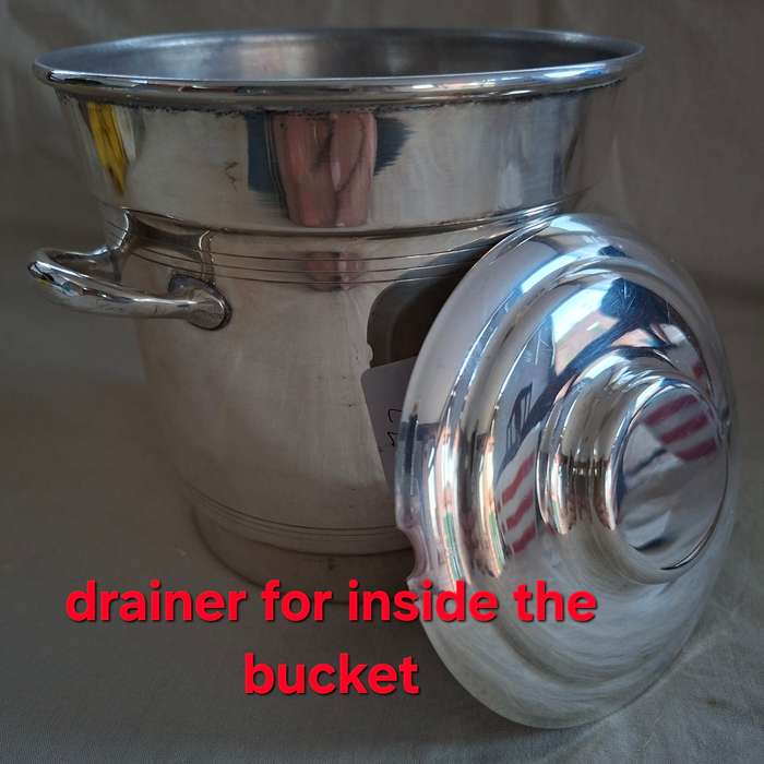 Silver plate ice bucket with tongs.   Quality Louis Silver plate with ice water drainer