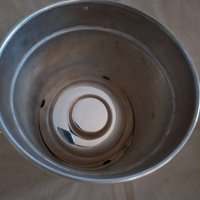 Silver plate ice bucket with tongs.   Quality Louis Silver plate with ice water drainer