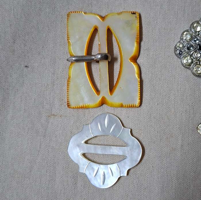 14 Vintage belt buckles - mother of pearl, glass, bakelite, and metal in vintage tin