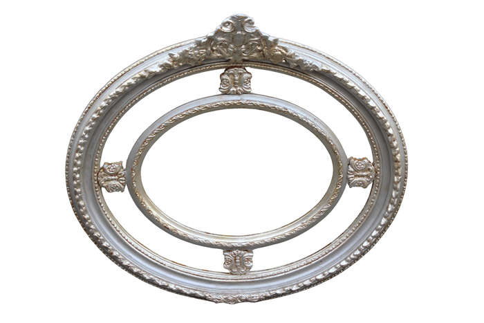 Ornate oval silver gilded mirror with crown