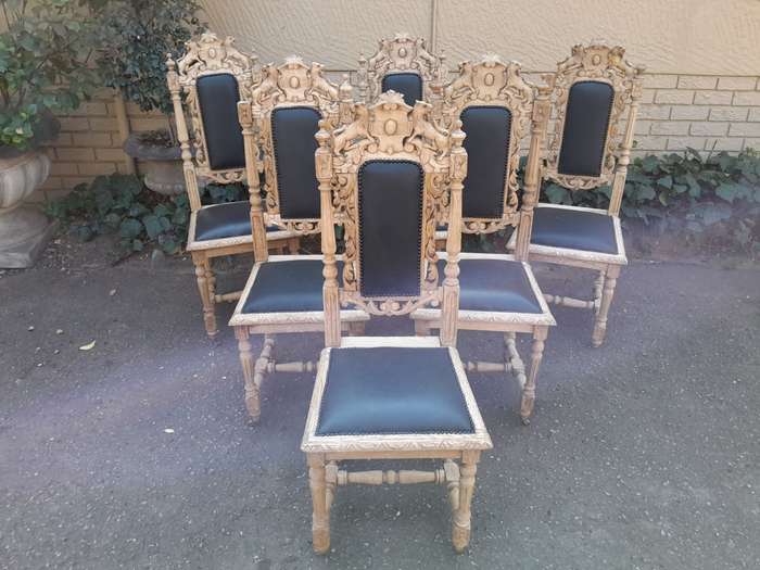 A 19th Century French Set of Six Ornately Carved Oak Chairs in a Contemporary Bleached Finish and...