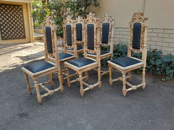 A 19th Century French Set of Six Ornately Carved Oak Chairs in a Contemporary Bleached Finish and...