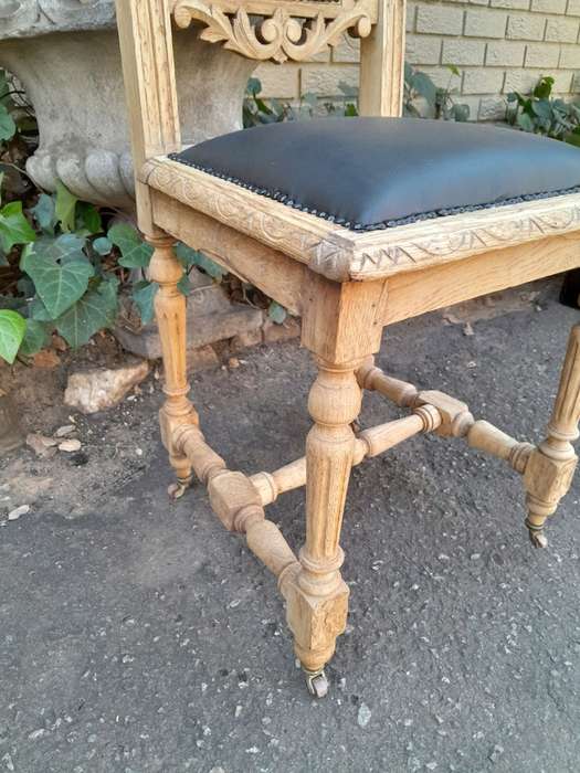 A 19th Century French Set of Six Ornately Carved Oak Chairs in a Contemporary Bleached Finish and...
