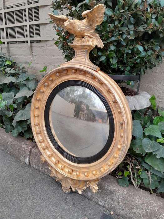 An  English Antique 19th Century Circa 1830s Regency Convex Mirror with Eagle and Ball Detail