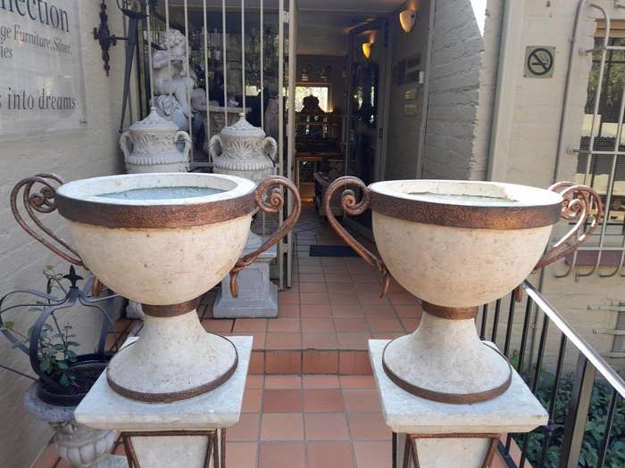 A 20th Century Decorative Pair Of Metal And Stone Urns On Stands