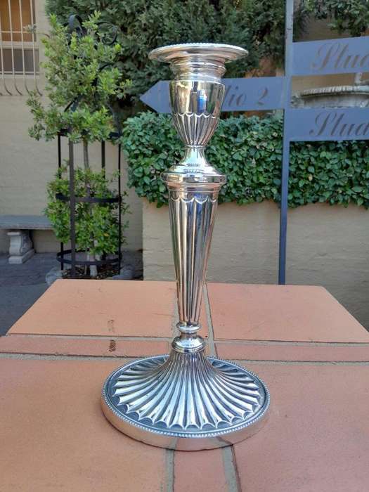 An Early 19th Century Pair of George III Old Sheffield Plated Candlesticks On Loaded Bases
