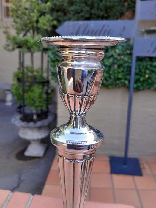 An Early 19th Century Pair of George III Old Sheffield Plated Candlesticks On Loaded Bases