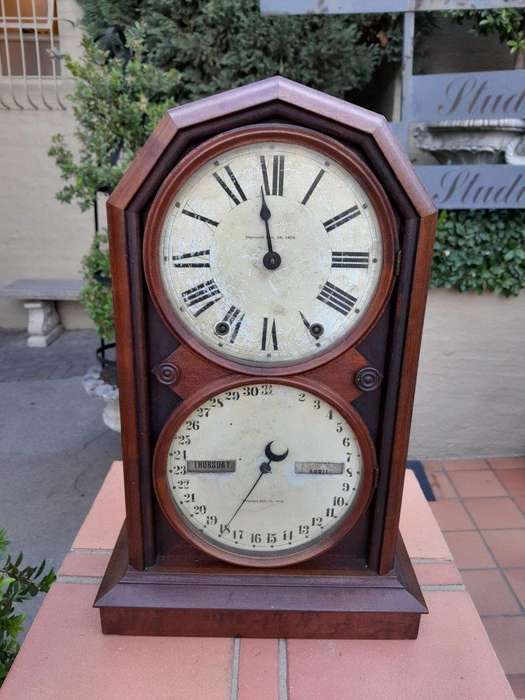 An Antique Late 19th Century Mahogany Calendar Clock With Date And Time Dials