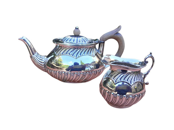 An Electroplated Silver Teapot And Milk Jug